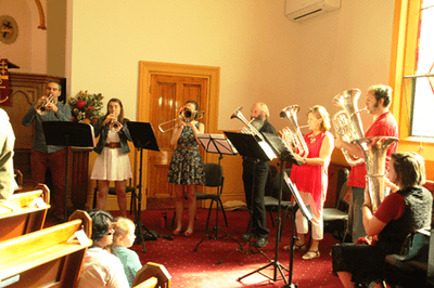 Brass musicians playing at worship